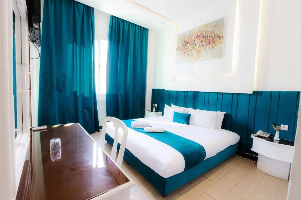 Teal double bedroom at Windsor Hotel City Center Casablanca